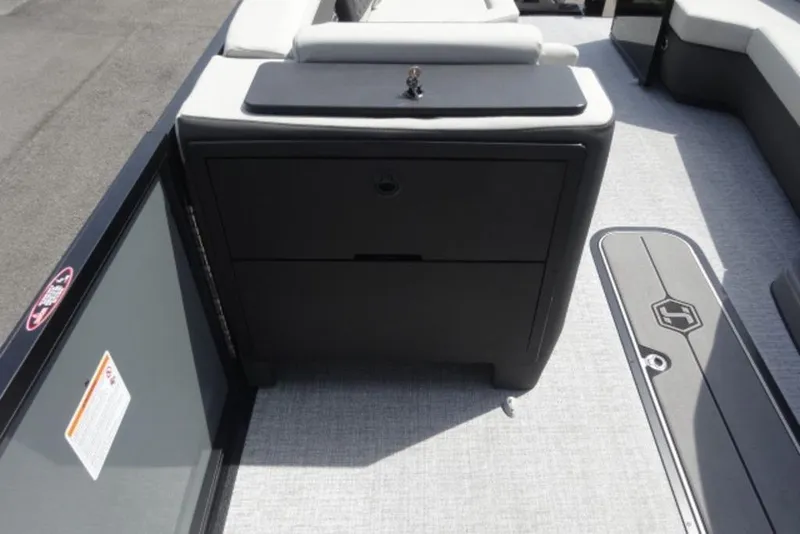 Slide: The Image of 2026 Harris Sunliner 250 boat interior with sleek storage compartment and modern flooring. - 15