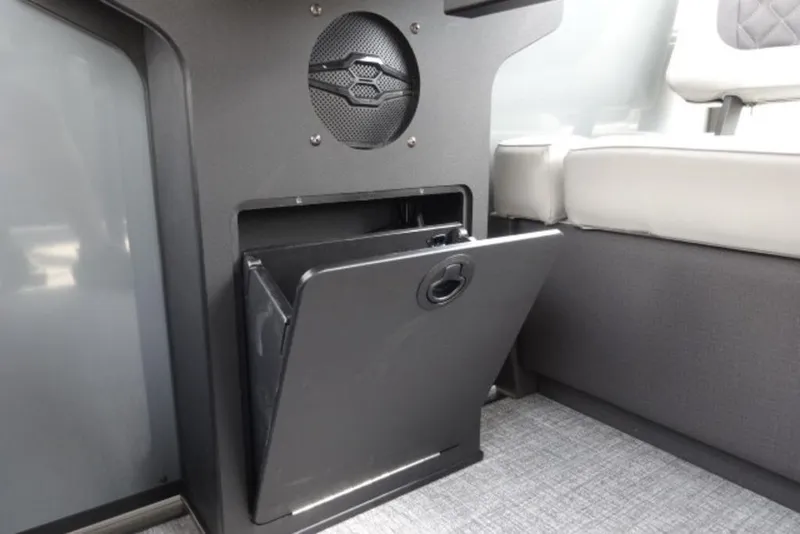 Slide: The Image of Interior storage compartment in 2026 Harris Sunliner 250 boat with speaker system. - 19