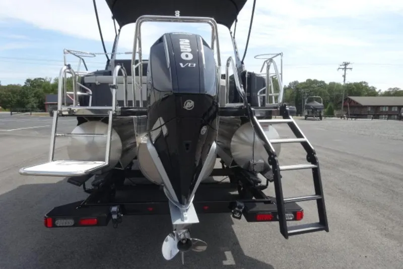 Slide: The Image of 2026 Harris Sunliner 250 pontoon boat with V8 engine, rear view on trailer. - 4