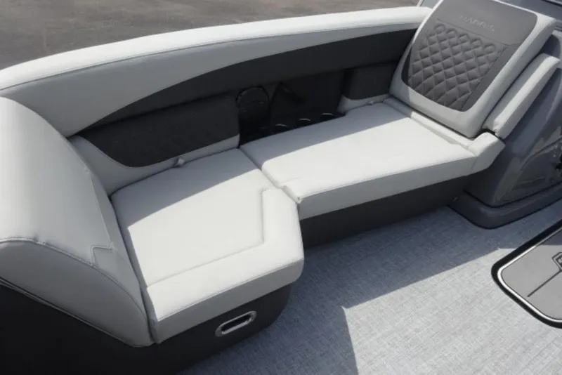 Slide: The Image of 2026 Harris Sunliner 250 boat interior with luxurious gray seating and quilted backrest. - 5