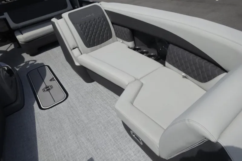 Slide: The Image of 2026 Harris Sunliner 250 boat interior with luxurious seating and modern design. - 6