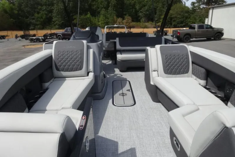 Slide: The Image of 2026 Harris Sunliner 250 pontoon boat interior with luxurious seating and modern design. - 7