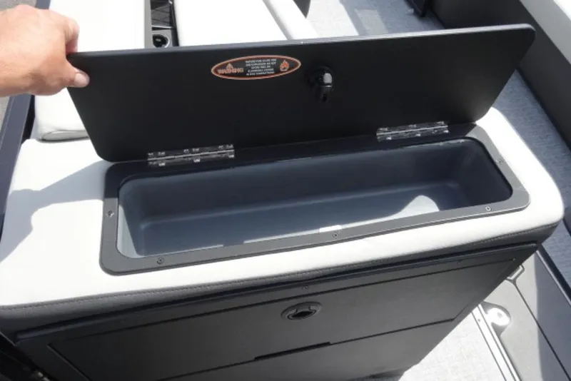 Slide: The Image of Open storage compartment on 2026 Harris Sunliner 250 boat, showcasing interior space. - 8