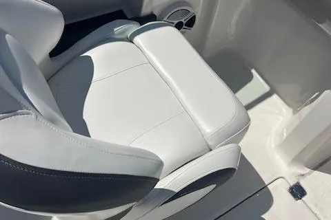 Slide: The Image of 2015 Chaparral 21 H2O Sport boat seat, white leather upholstery, close-up view. - 10