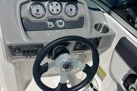 Slide: The Image of 2015 Chaparral 21 H2O Sport dashboard with steering wheel and gauges. - 12