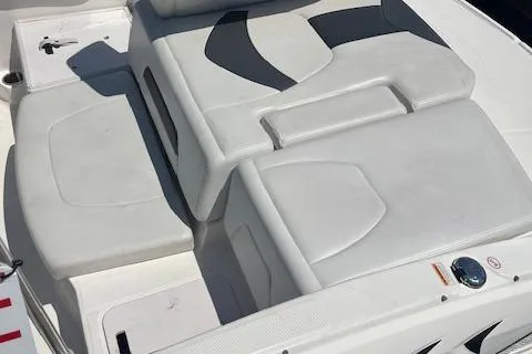 Slide: The Image of 2015 Chaparral 21 H2O Sport boat interior seating, white upholstery, modern design. - 4