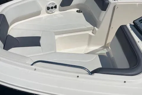 Slide: The Image of 2015 Chaparral 21 H2O Sport boat interior with cushioned seating and speaker. - 7