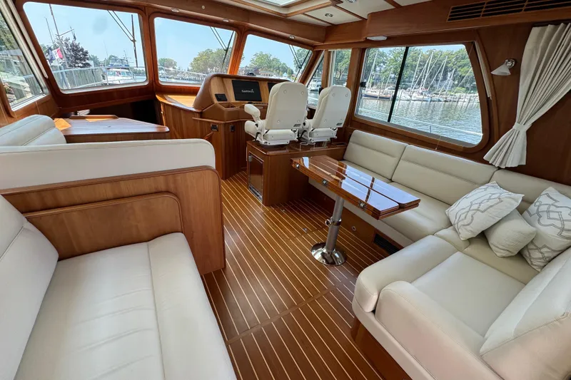 Slide: The Image of Luxurious interior of 2022 Sabre 48 Salon Express yacht with elegant seating and wooden finishes. - 24