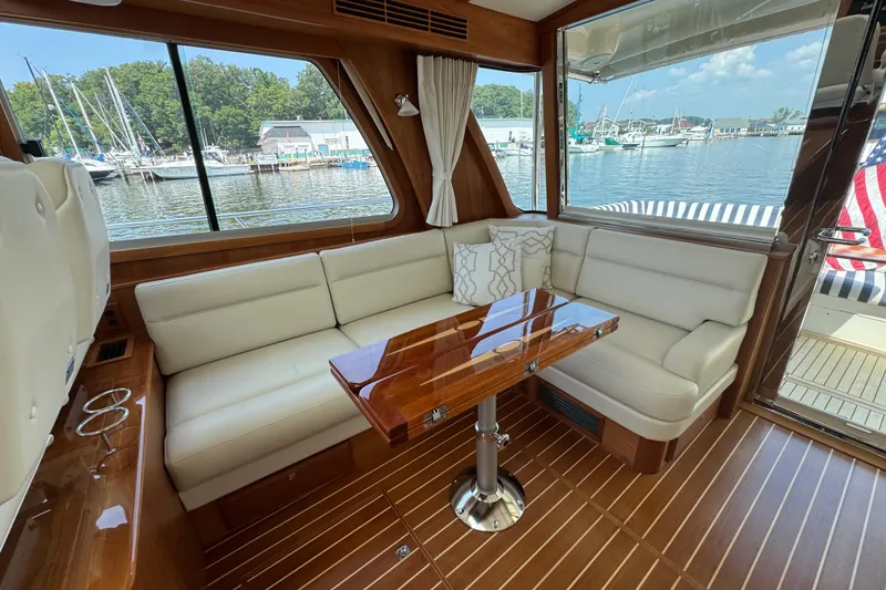 Slide: The Image of Luxurious interior of 2022 Sabre 48 Salon Express yacht with elegant seating and wooden table. - 25