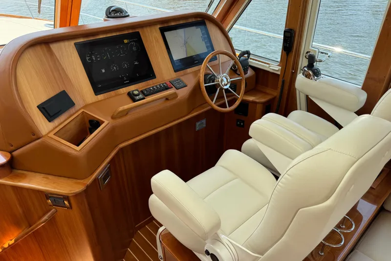 Slide: The Image of 2022 Sabre 48 Salon Express helm with leather seats and modern navigation displays. - 35