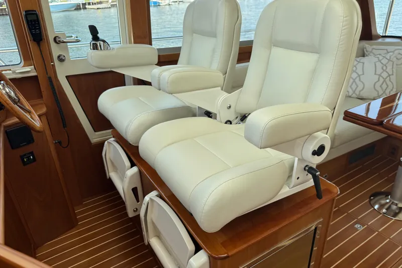 Slide: The Image of Luxurious interior of 2022 Sabre 48 Salon Express with plush white seating. - 37