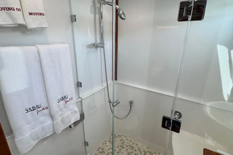 Slide: The Image of Modern shower in 2022 Sabre 48 Salon Express yacht with branded towels. - 51