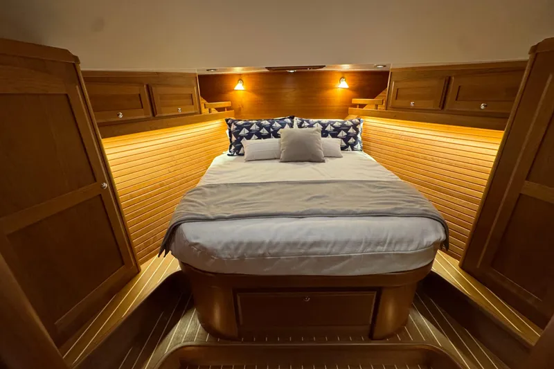 Slide: The Image of Luxurious cabin interior of 2022 Sabre 48 Salon Express yacht with cozy bedding. - 55