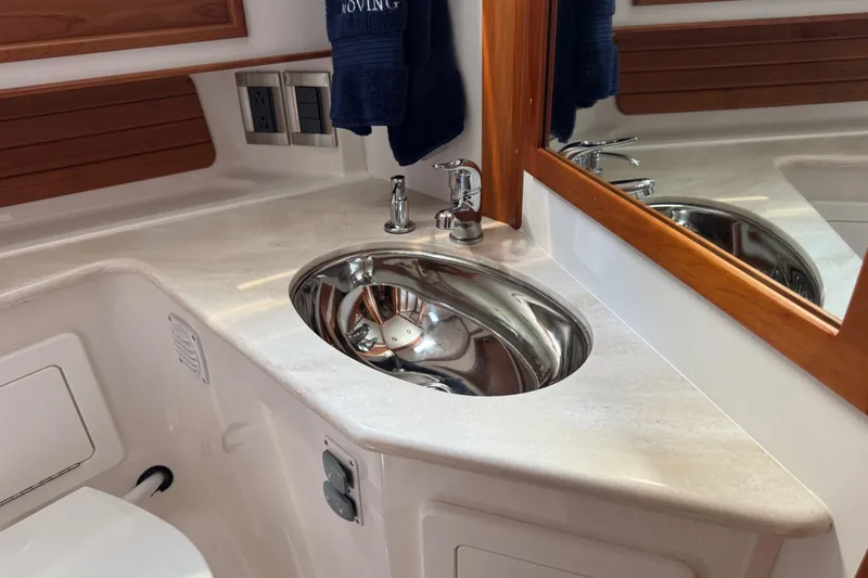 Slide: The Image of Luxurious bathroom sink in 2022 Sabre 48 Salon Express yacht, featuring sleek design and modern fixtures. - 58