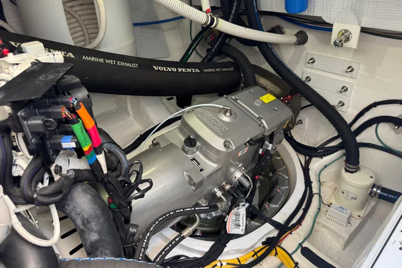 Slide: The Image of Engine room of 2022 Sabre 48 Salon Express with Volvo Penta components and wiring. - 70