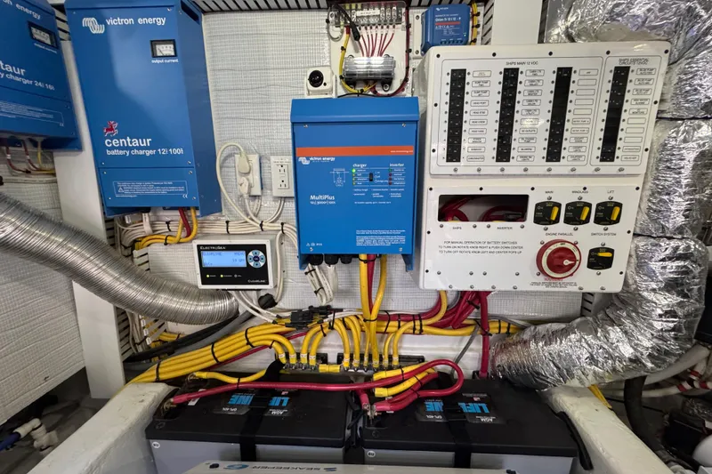 Slide: The Image of Electrical system of 2022 Sabre 48 Salon Express with chargers and control panel. - 72