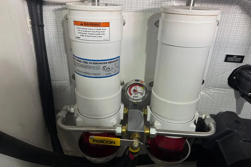 Slide: The Image of Diesel fuel filter system in 2022 Sabre 48 Salon Express yacht engine room. - 78