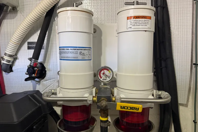 Slide: The Image of Engine room of 2022 Sabre 48 Salon Express with fuel filter system. - 79