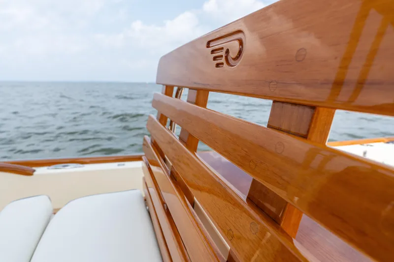 Slide: The Image of Hinckley Talaria 29C 2017 boat with polished wooden seating, ocean view. - 25
