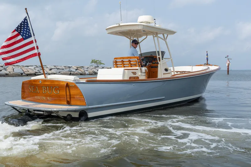 Slide: The Image of 2017 Hinckley Talaria 29C boat named "Sea Bug" in Avalon, NJ, with American flag. - 3