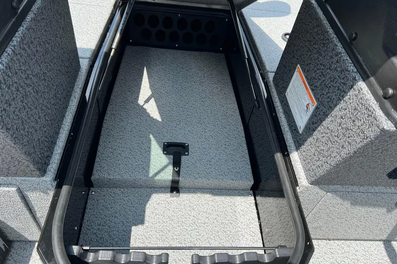 Slide: The Image of 2026 Lund 1875 Impact XS Sport boat storage compartment, open and empty. - 13