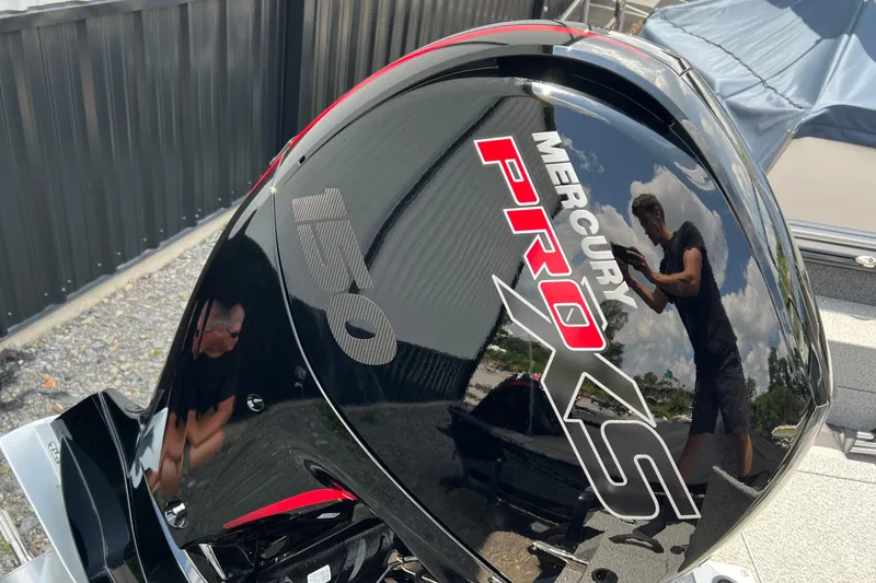 Slide: The Image of Mercury Pro XS 150 engine on 2026 Lund 1875 Impact XS Sport boat. - 16