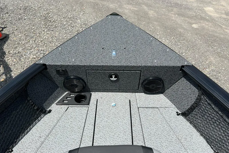 Slide: The Image of 2026 Lund 1875 Impact XS Sport boat interior with speakers and storage compartments. - 6