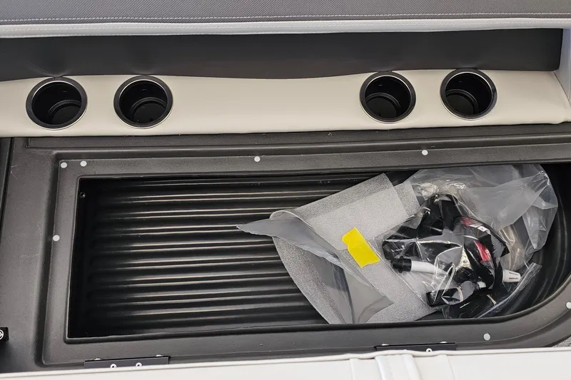 Slide: The Image of 2026 Sun Tracker BB-16 XL Select boat interior with cup holders and storage compartment. - 14