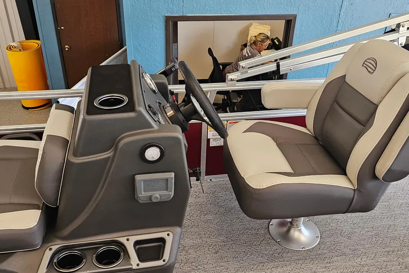 Slide: The Image of 2026 Sun Tracker BB-16 XL Select boat interior with steering console and cushioned seat. - 8