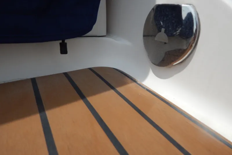 Slide: The Image of 2016 Chaparral 277 SSX boat interior with wood finish and chrome detail. - 12