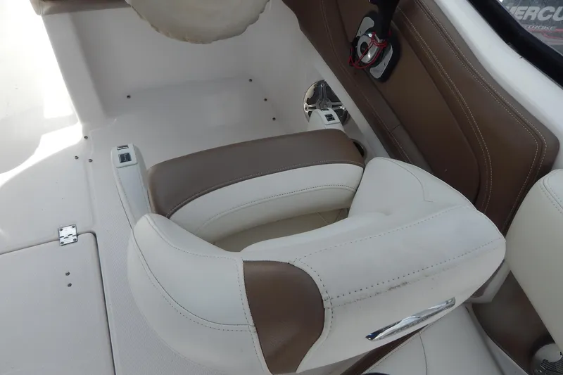Slide: The Image of 2016 Chaparral 277 SSX boat interior with brown and white seating. - 16