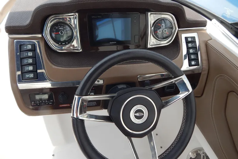 Slide: The Image of Dashboard of 2016 Chaparral 277 SSX boat with steering wheel and control panel. - 19