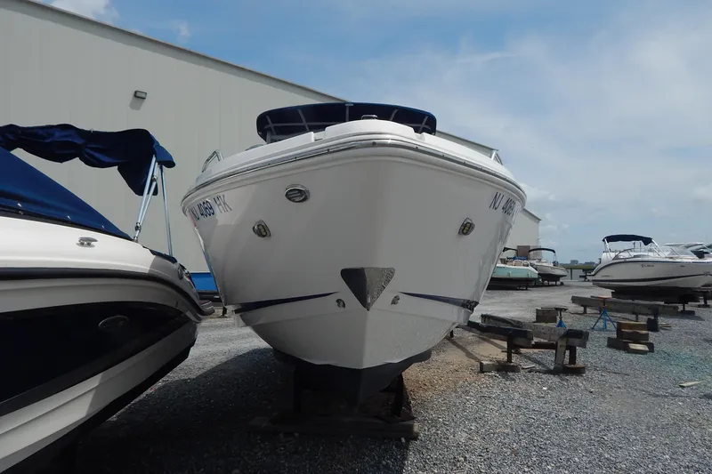 Slide: The Image of 2016 Chaparral 277 SSX boat on dry dock, surrounded by other vessels. - 2
