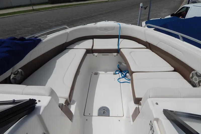 Slide: The Image of 2016 Chaparral 277 SSX boat interior with white and brown seating. - 23
