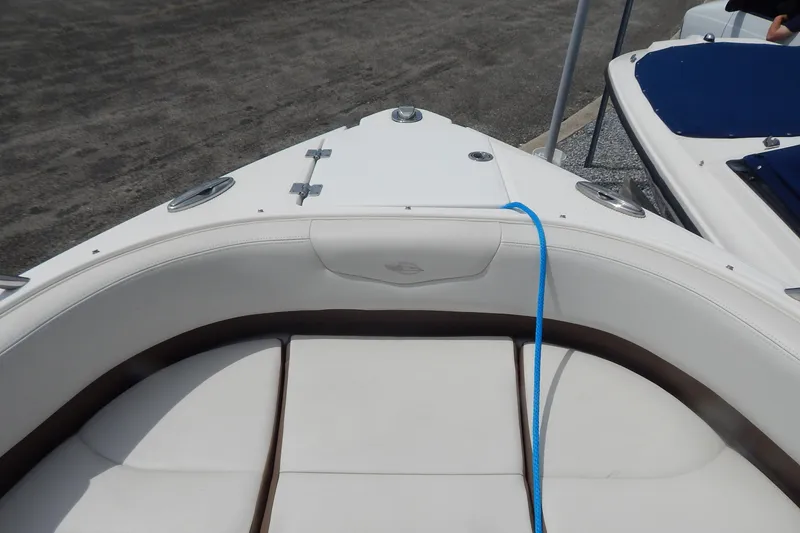 Slide: The Image of 2016 Chaparral 277 SSX boat interior with white seating and blue rope. - 24