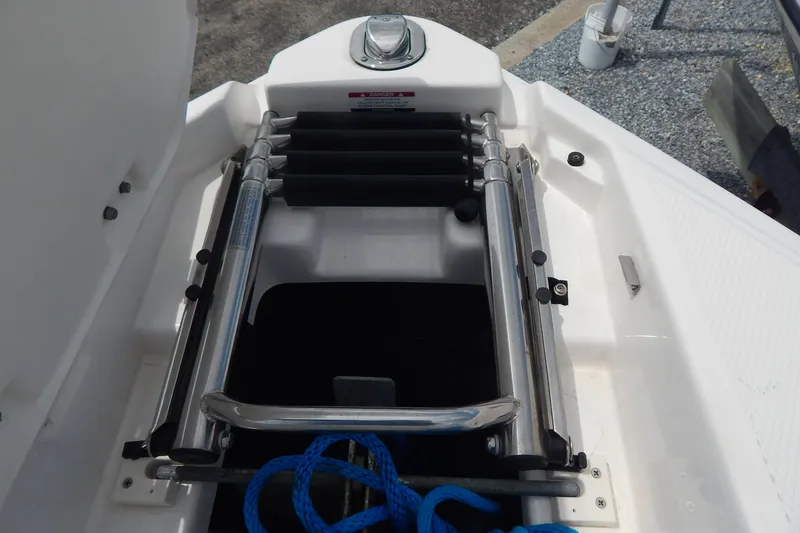 Slide: The Image of 2016 Chaparral 277 SSX boat ladder with blue rope on deck. - 25