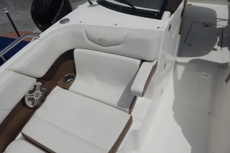 Slide: The Image of 2016 Chaparral 277 SSX boat interior with white seating and speaker. - 27