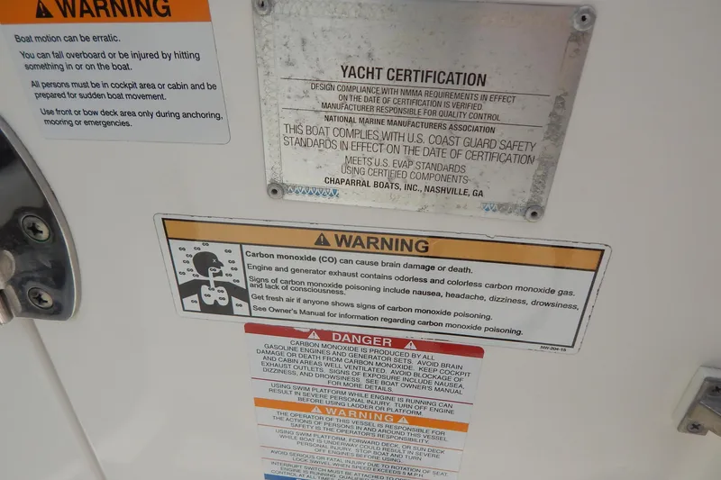 Slide: The Image of Warning and certification labels on 2016 Chaparral 277 SSX boat, emphasizing safety and compliance. - 29
