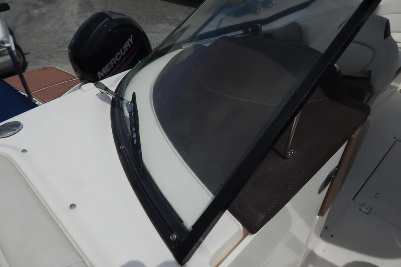 Slide: The Image of 2016 Chaparral 277 SSX boat with Mercury engine, featuring windshield and seating area. - 30