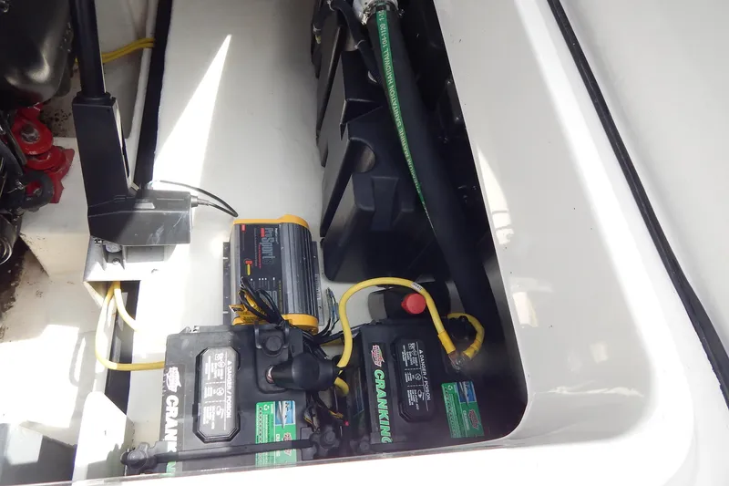 Slide: The Image of 2016 Chaparral 277 SSX boat battery compartment with wiring and components. - 39