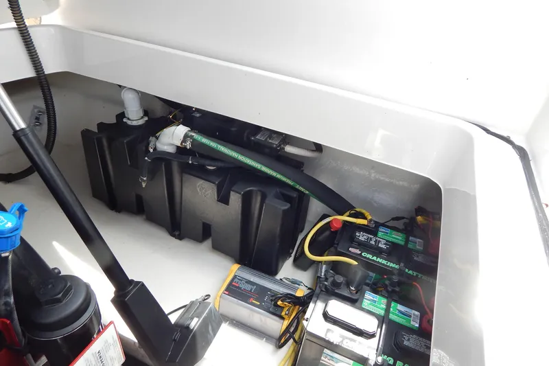 Slide: The Image of 2016 Chaparral 277 SSX boat battery compartment with wiring and components. - 43