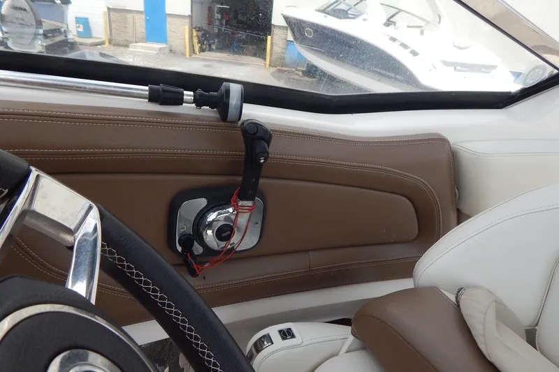 Slide: The Image of Interior view of 2016 Chaparral 277 SSX boat cockpit with steering wheel and controls. - 45