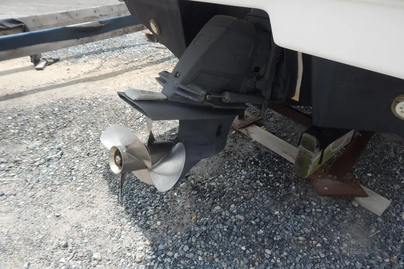 Slide: The Image of 2016 Chaparral 277 SSX boat propeller and drive system on gravel surface. - 5