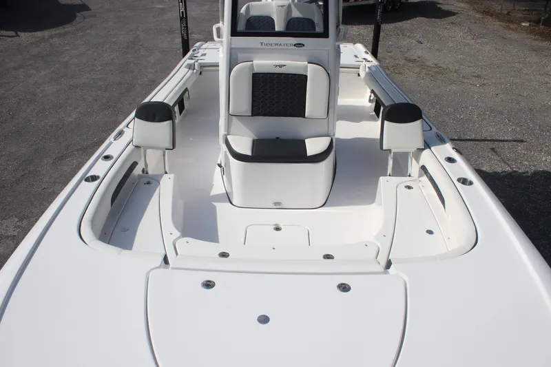 Slide: The Image of 2026 Tidewater 2500 Carolina Bay boat with Yamaha outboard motor, parked outdoors. - 12