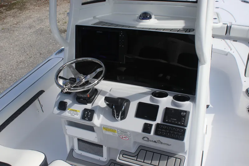 Slide: The Image of 2026 Tidewater 2500 Carolina Bay boat compartment with open hatch and latch. - 14