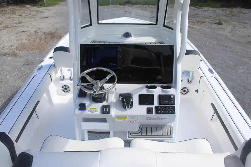 Slide: The Image of 2026 Tidewater 2500 Carolina Bay boat interior with seating and storage compartments. - 16
