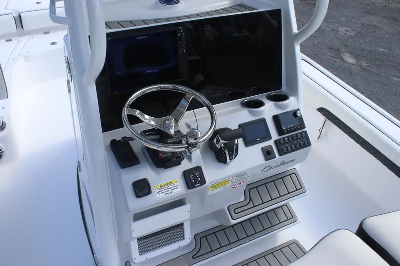 Slide: The Image of Luxury seating on 2026 Tidewater 2500 Carolina Bay boat, featuring black and white cushioned design. - 17