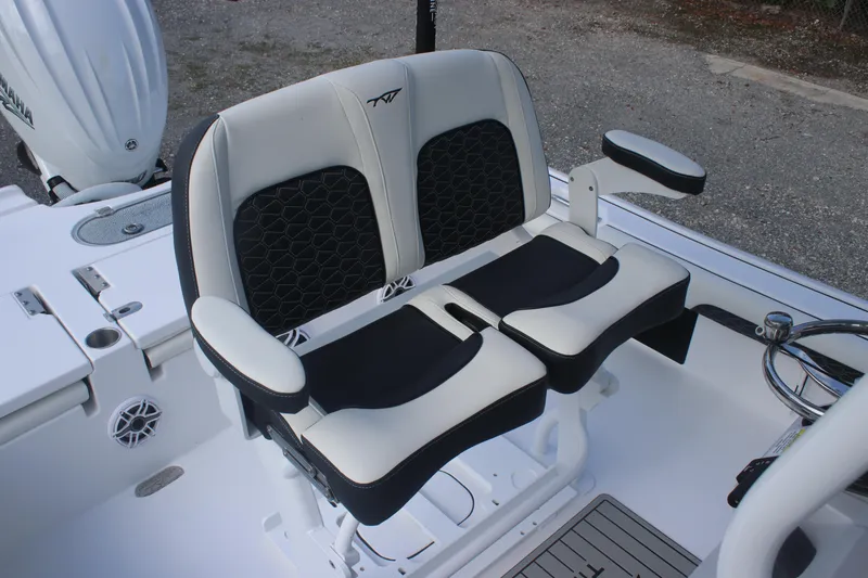 Slide: The Image of 2026 Tidewater 2500 Carolina Bay boat console with steering wheel and control panel. - 18