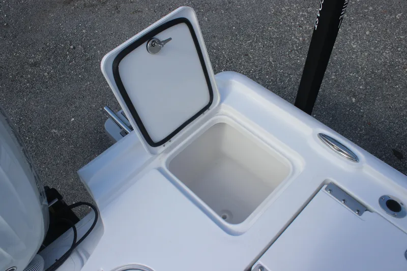 Slide: The Image of 2026 Tidewater 2500 Carolina Bay boat console with steering wheel and navigation controls. - 19