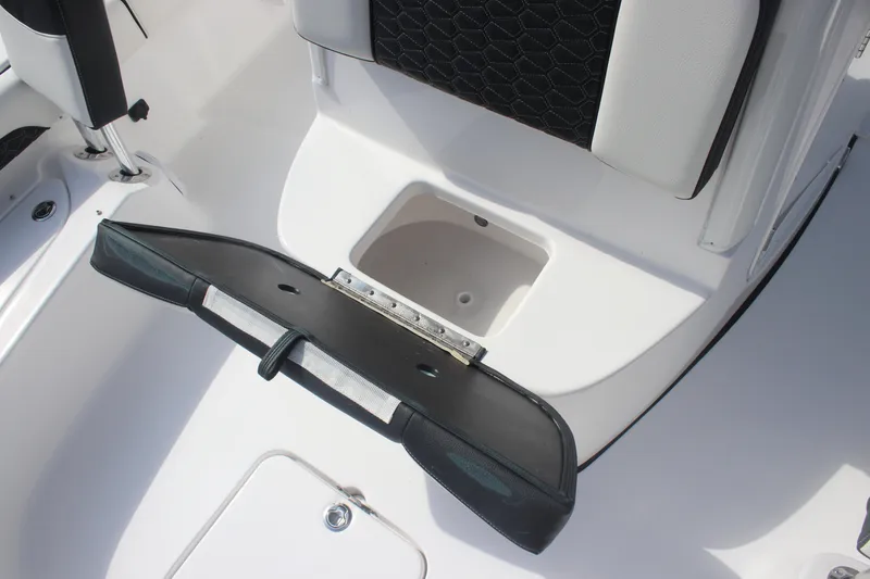 Slide: The Image of Open storage compartment on 2026 Tidewater 2500 Carolina Bay boat, showing interior details. - 22